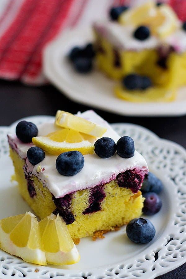 This Lemon Blueberry Poke Cake is the ultimate summer dessert. With homemade blueberry sauce and whipped cream on top, this dessert is perfect for any occasion!