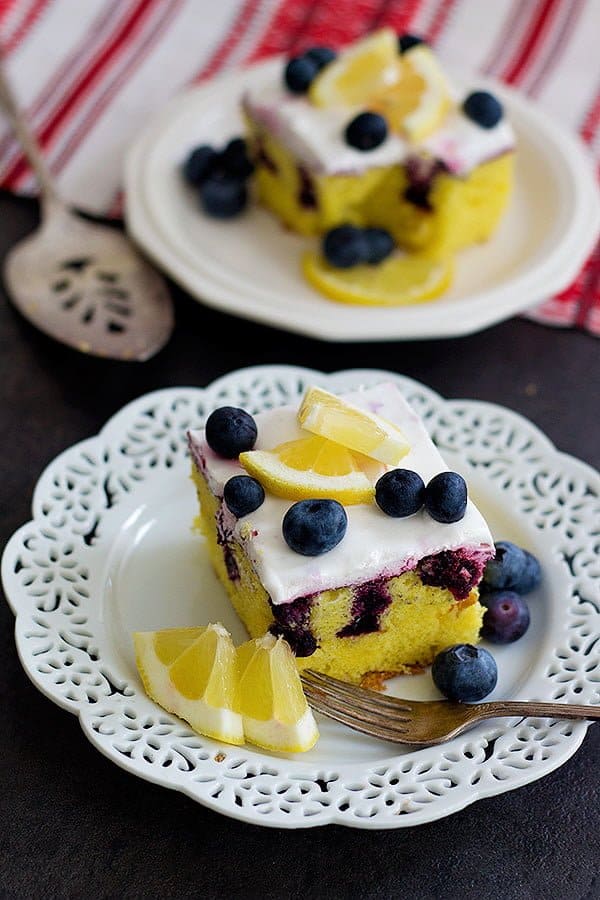 This Lemon Blueberry Poke Cake is the ultimate summer dessert. With homemade blueberry sauce and whipped cream on top, this dessert is perfect for any occasion!