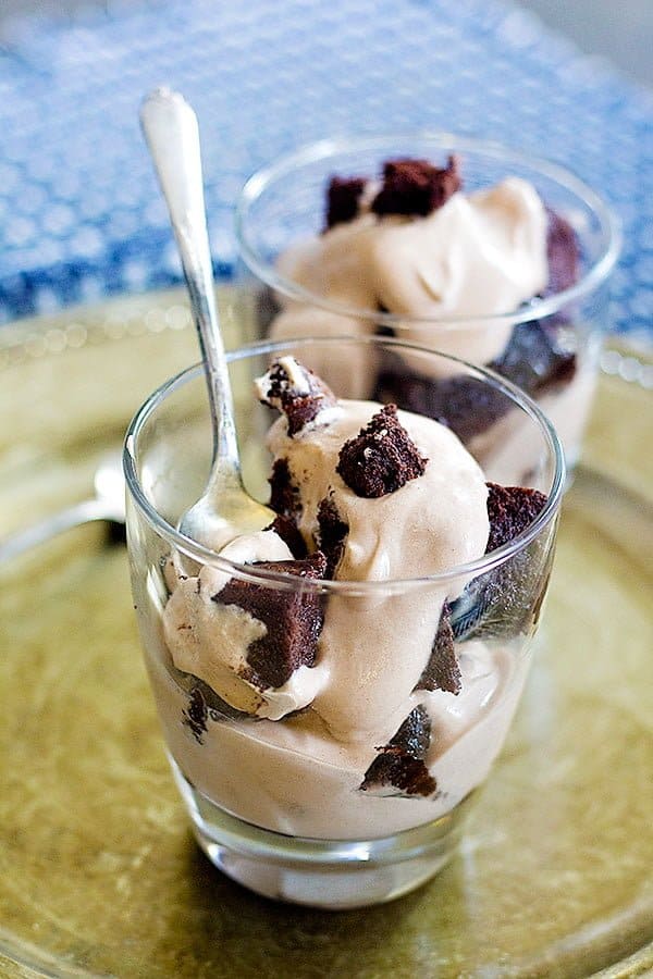 brownies and cream cheese filling in a cup.
