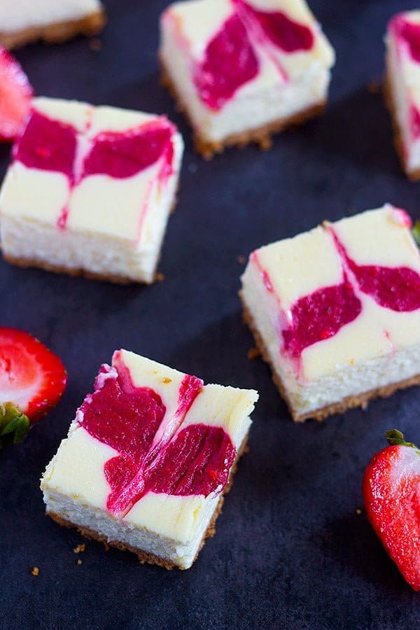 Strawberry Swirl Cheesecake Bars can be your easy, go to dessert recipe this summer. Everyone loves a creamy and luscious cheesecake topped with delicious homemade strawberry swirl.