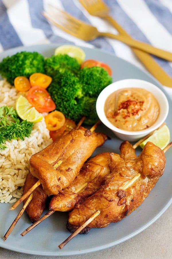 Make these delicious Thai Chicken Skewers with Spicy Peanut Sauce for an amazing family-friendly meal. The marinade is the key to these juicy and tasty skewers.