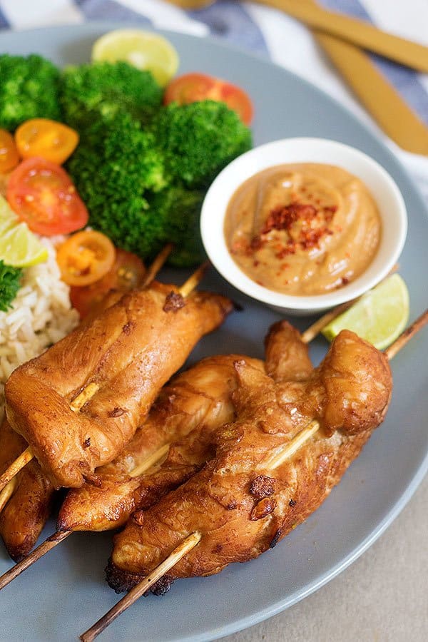 Make these delicious Thai Chicken Skewers with Spicy Peanut Sauce for an amazing family-friendly meal. The marinade is the key to these juicy and tasty skewers.