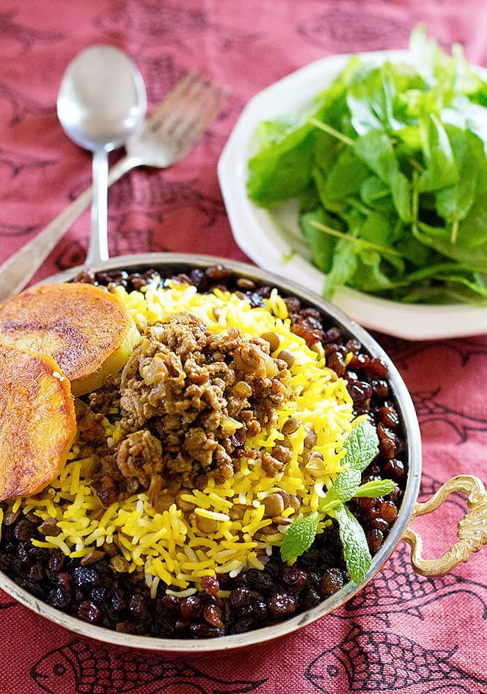 Persian rice with lentils is easy and simple to make and is topped with ground beef and saffron rice. 