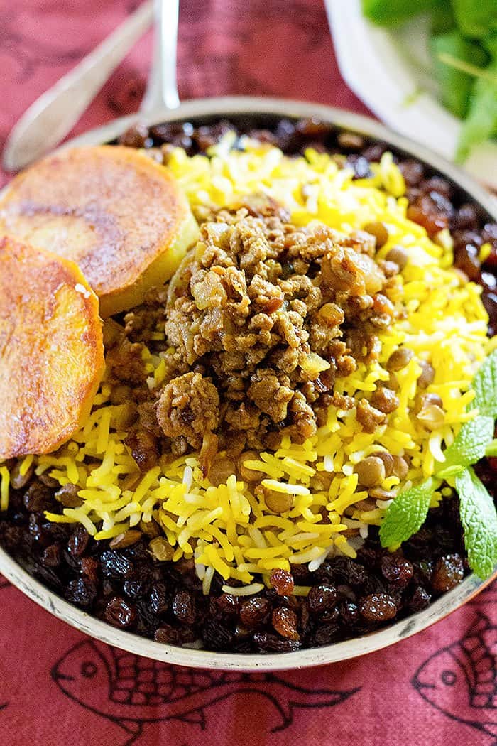 lentils and rice recipe is served with ground beef. raisins and saffron rice. 