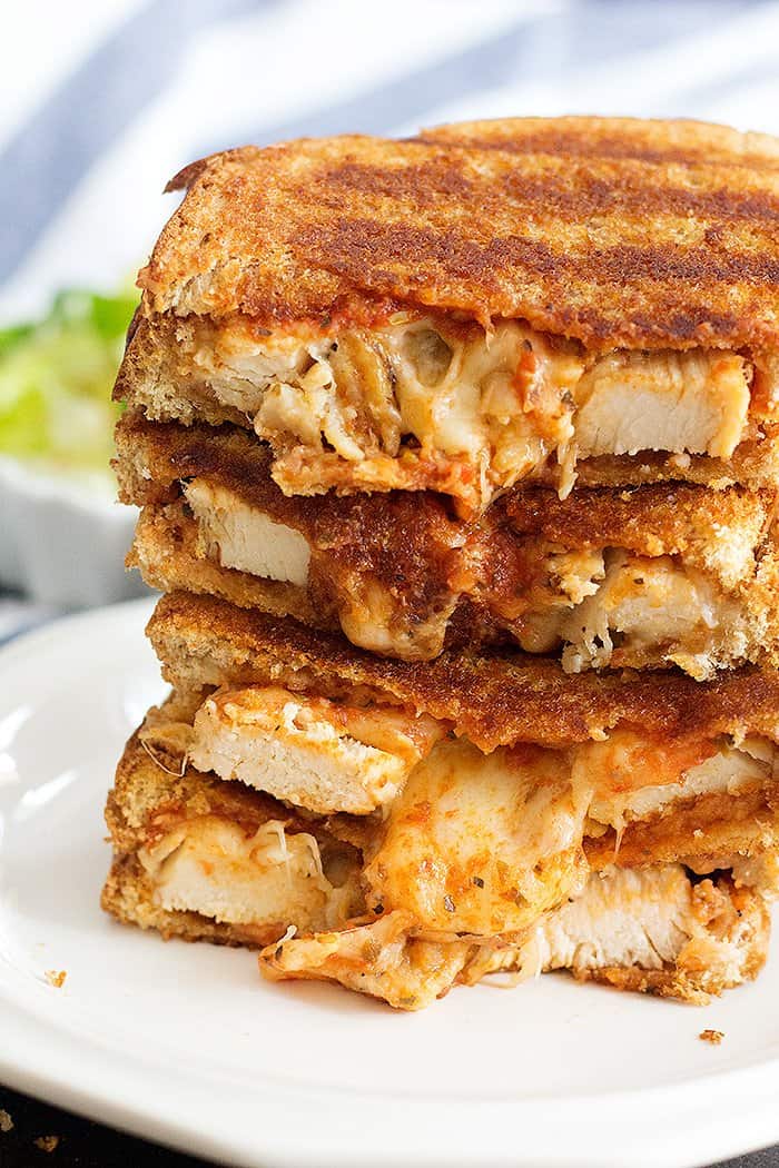 Grilled chicken cheese sandwich with chicken and cheese and marinara sauce