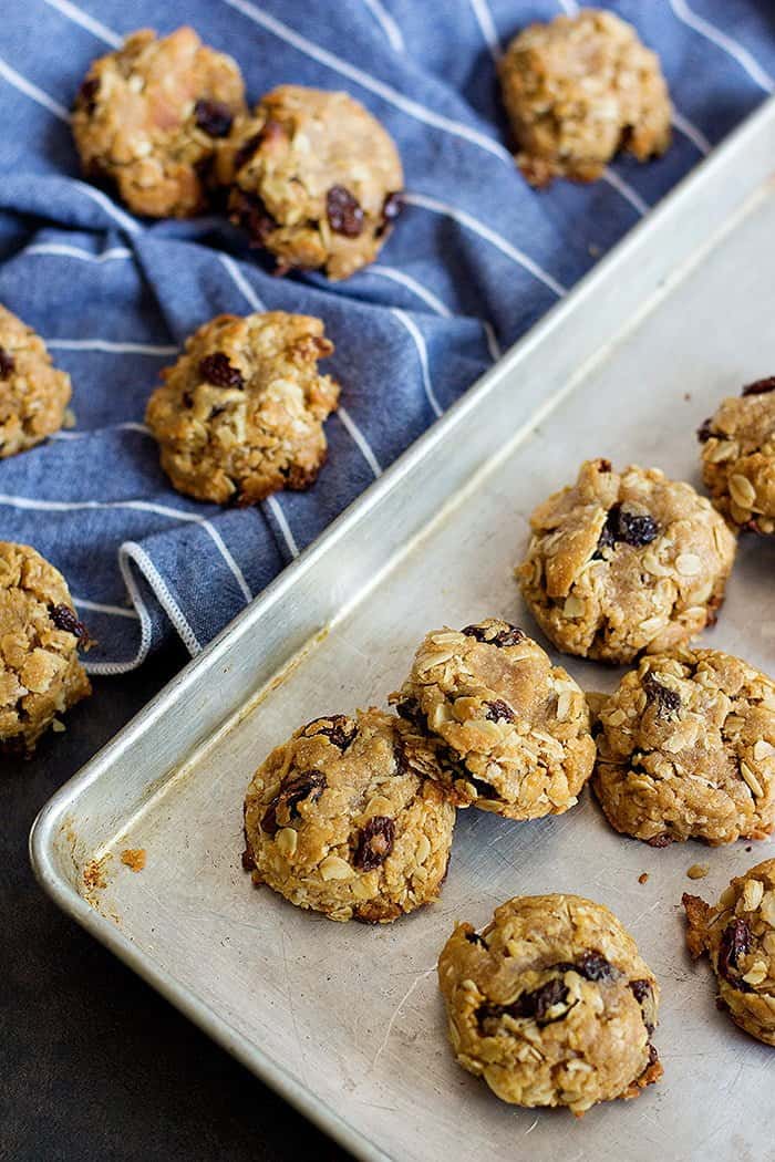 Peanut Butter Cookies with raisins on a baking sheet.