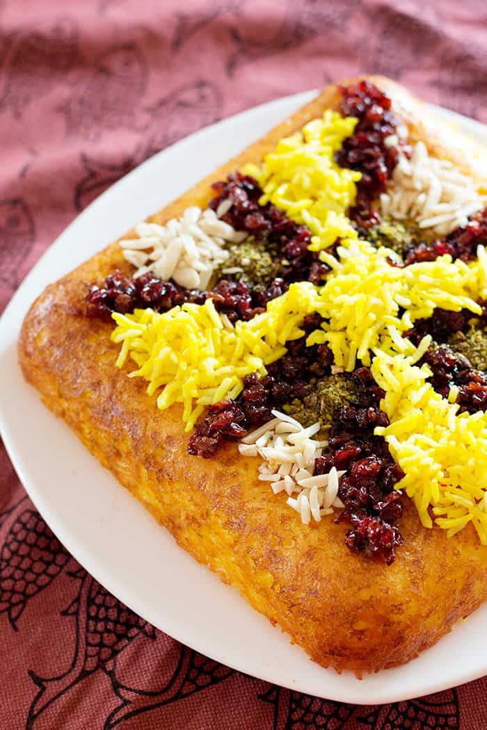 Persian Savory Saffron Cake - Tahchin is a very delicious traditional Persian rice dish full of saffron and great flavors. It is usually served with chicken in tomato sauce.
