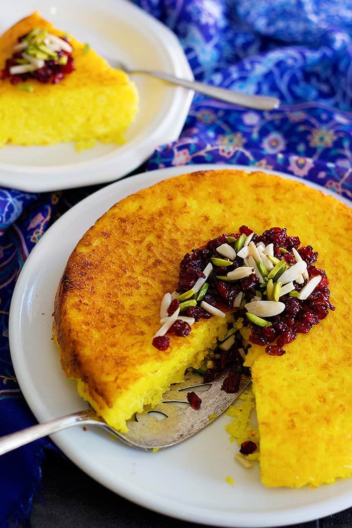 Persian Savory Saffron Cake - Tahchin is a very delicious traditional Persian rice dish full of saffron and great flavors. It is usually served with chicken in tomato sauce.