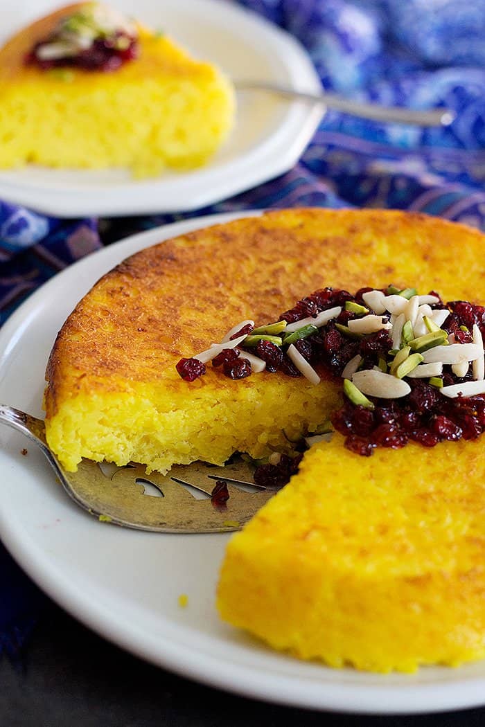 Persian Savory Saffron Cake - Tahchin is a very delicious traditional Persian rice dish full of saffron and great flavors. It is usually served with chicken in tomato sauce.