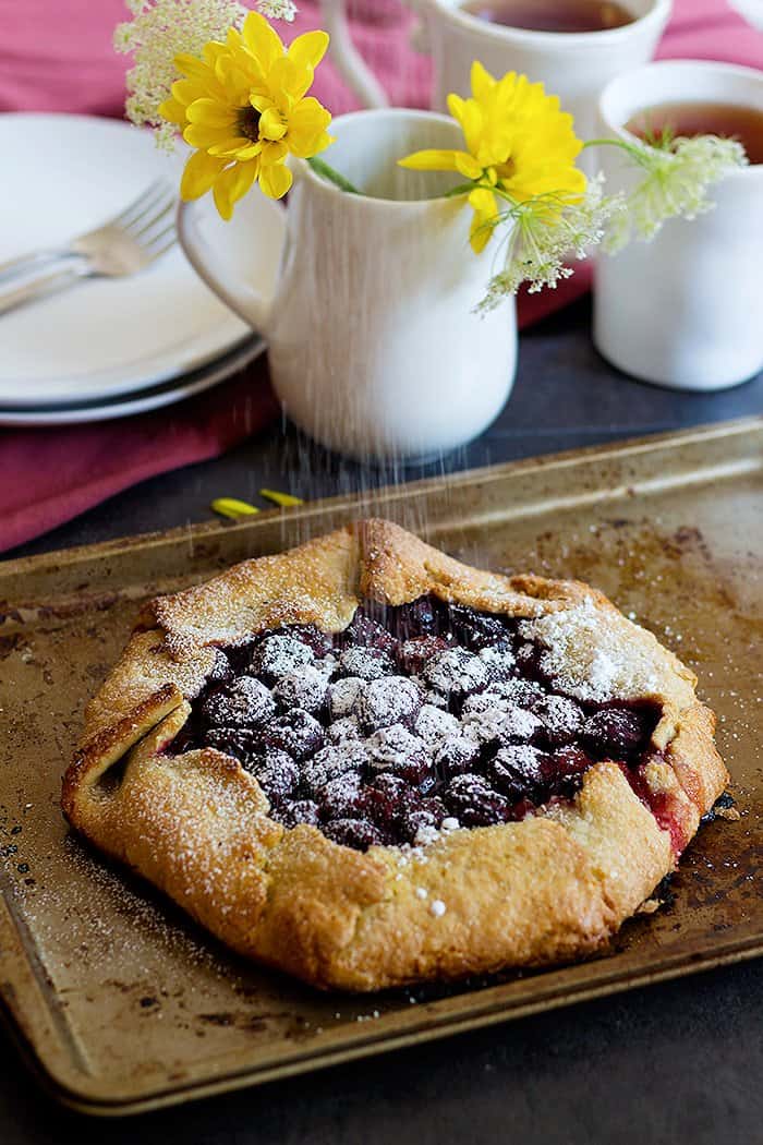 Sour cherry galette is one of my favorite summer treats! Galettes are free form tarts that can be filled with any fruits that are in season!