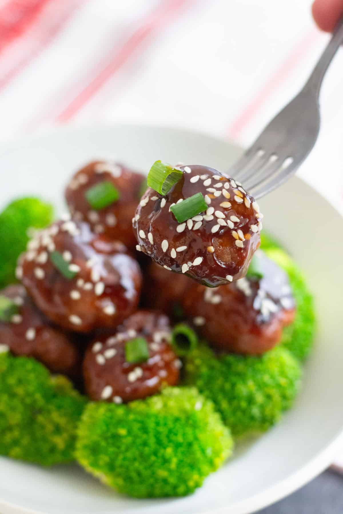 Bring amazing flavors to your usual meals with these Ginger Garlic Chicken Meatballs. These meatballs are light, delicious and smothered in homemade sauce!