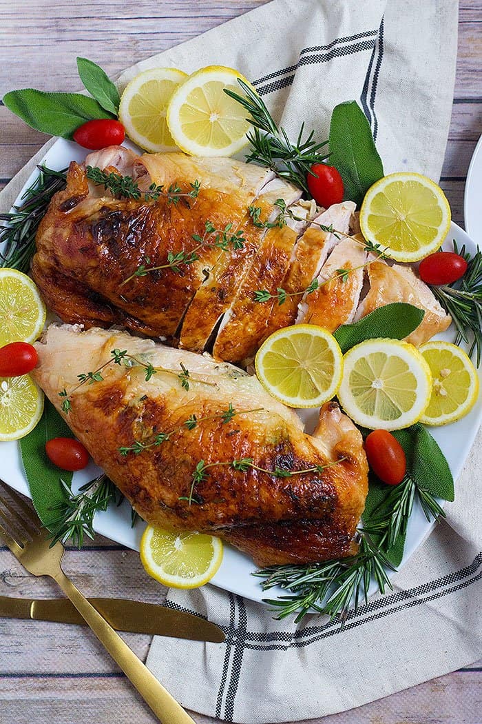 This herb roasted turkey breast recipe is perfect for a family dinner or your Thanksgiving table. The combination of herbs, butter and lemon results in a delicious and moist turkey breast.