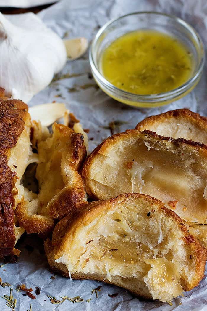 Garlic cheese pull apart bread with melted butter mixed with minded garlic