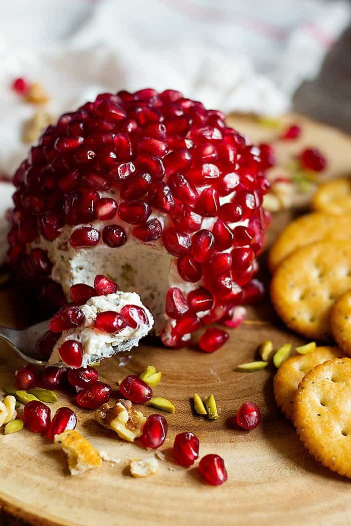 Pomegranate Cheese Ball is the perfect appetizer for fall and winter parties. This delicious cheese ball is packed with nuts and herbs.