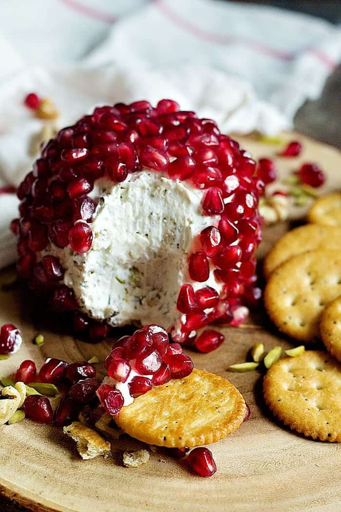 Pomegranate Cheese Ball - Cream cheese mixed with nuts and herbs, rolled in pomegranate arils and served with crackers. 