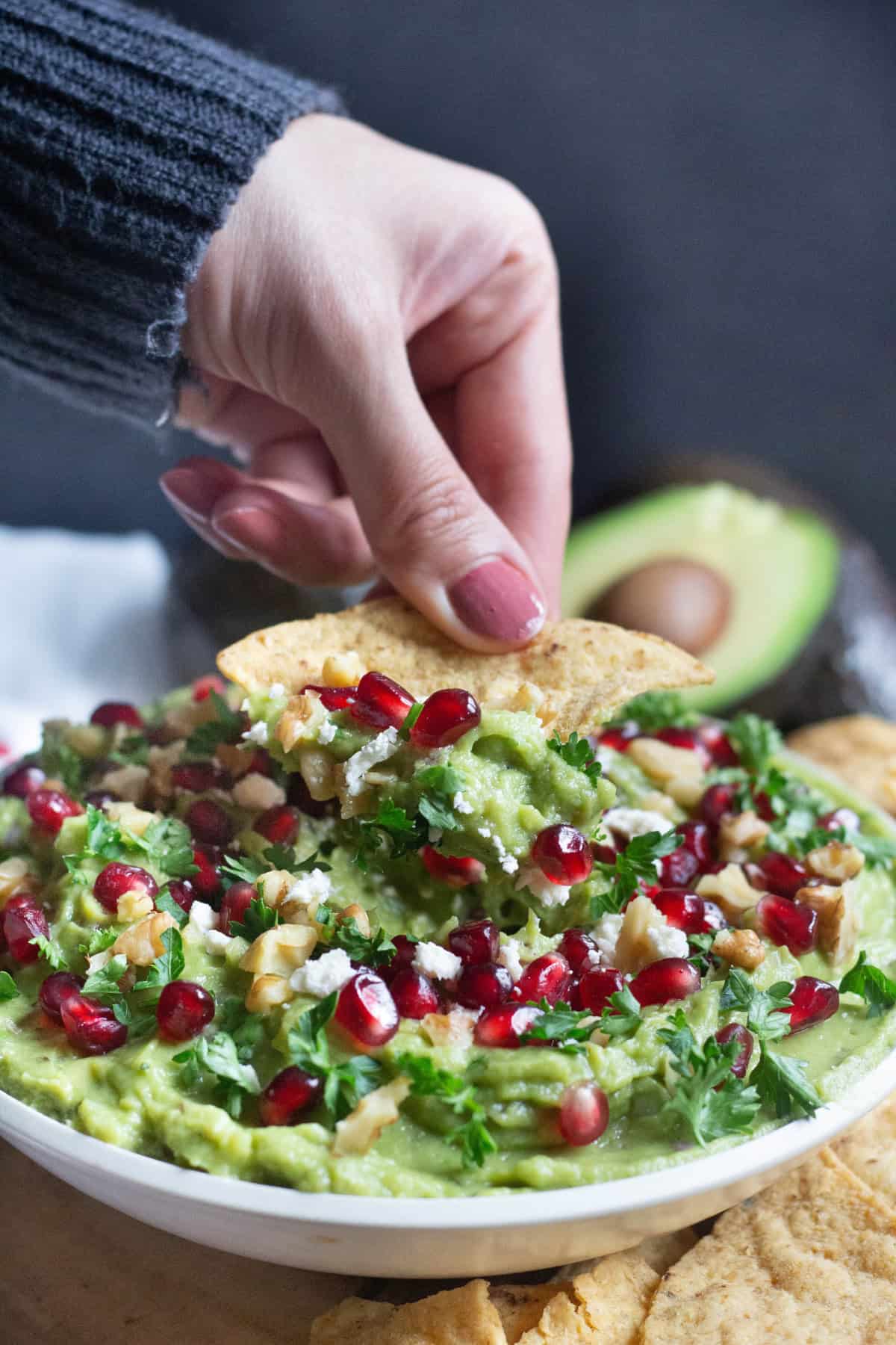 Bring all the festivities to your table with this delicious pomegranate guacamole. Gorgeous jewels of pomegranate with walnuts and feta brings a whole new flavor to the good old favorite!