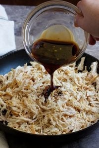 Pour the Asian sauce on shredded chicken and mix well. Cook until the chicken absorbs all the flavors. 