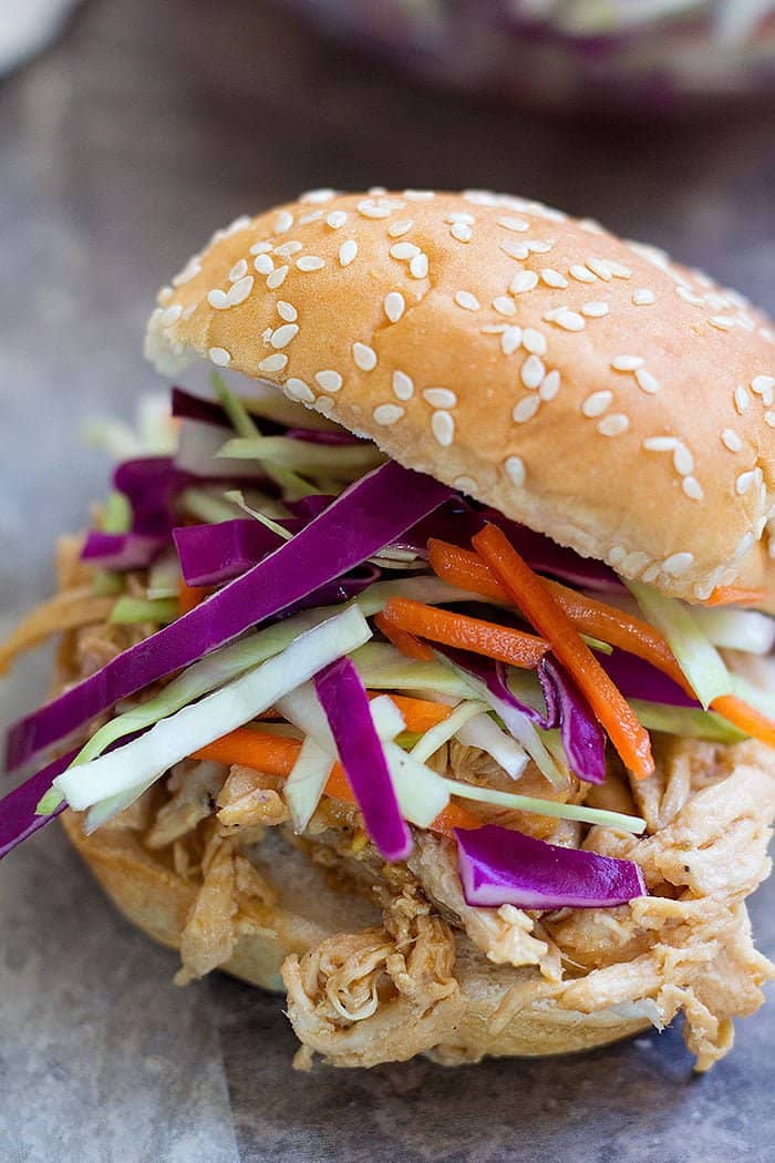 These Asian Chicken Sliders are to die for! Shredded chicken mixed with Asian flavors and a delicious slaw, these chicken sliders are perfect for feeding a crowd!