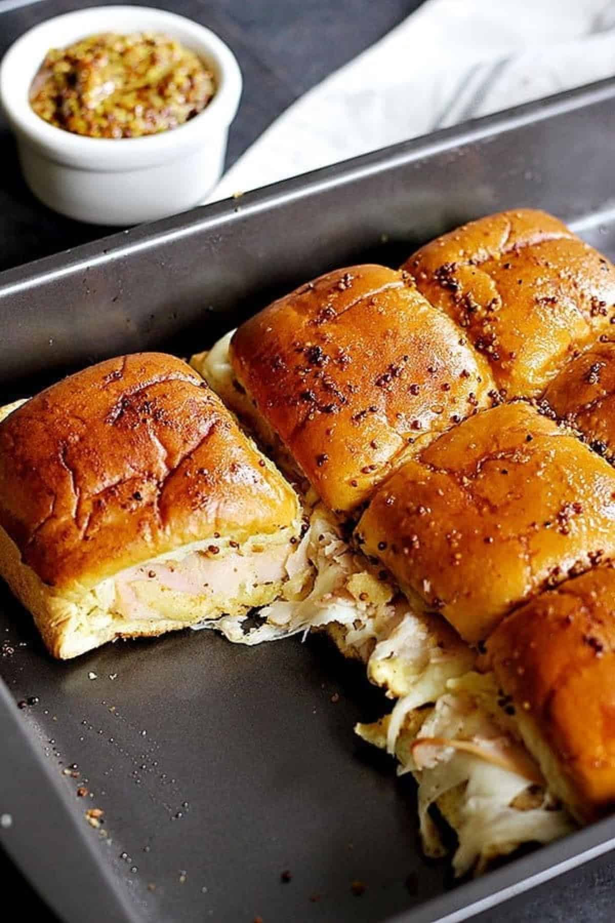 You can bake sliders in a 9x13 baking pan at 350F.