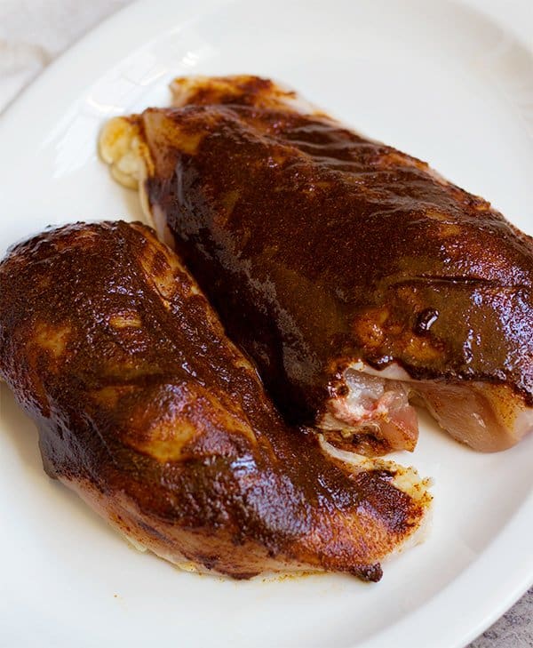 Rub the Moroccan chicken marinade paste all over the chicken breast. 