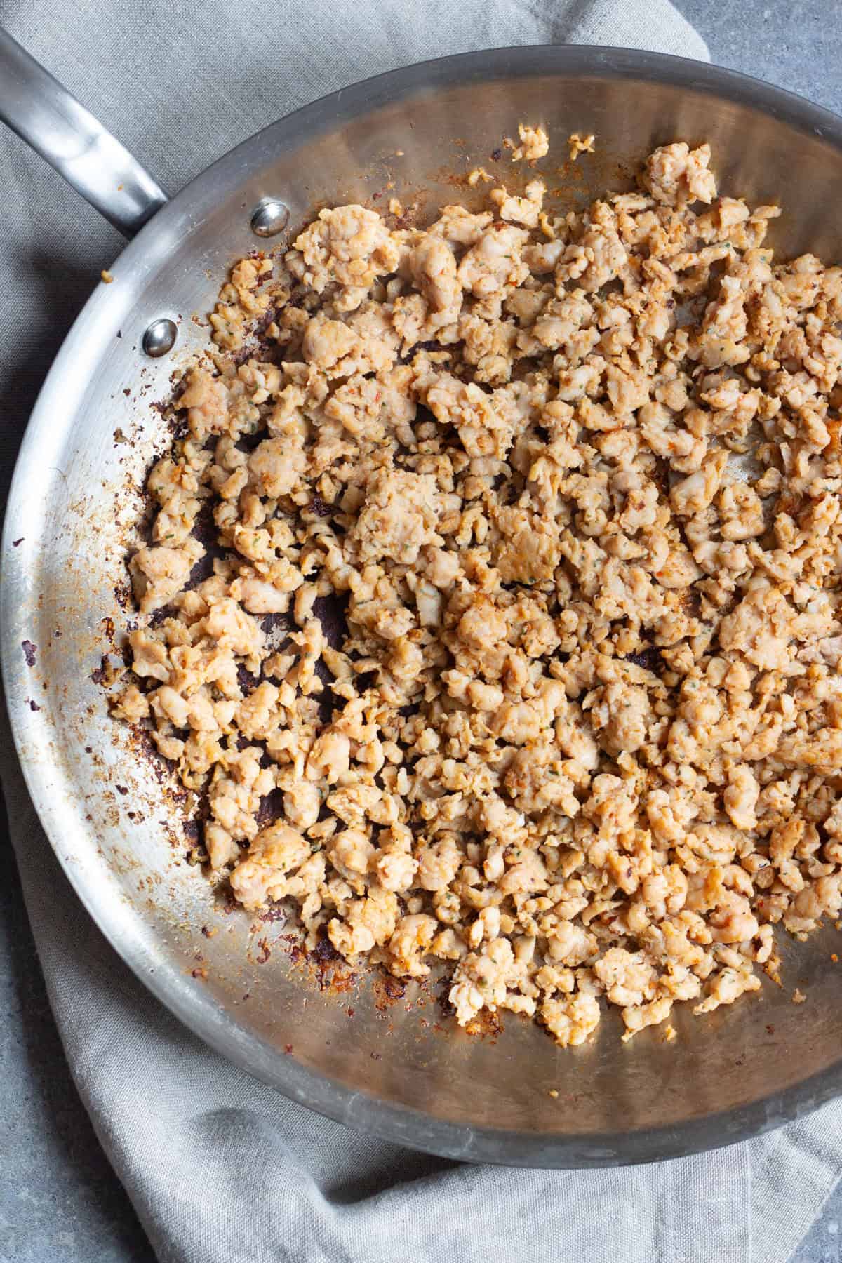 To make Breakfast Pizza with Sausage, start browning sausage. 