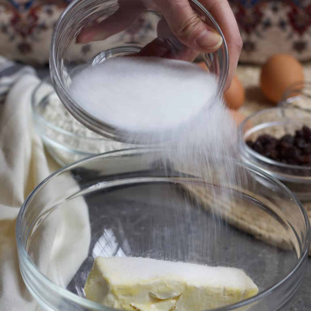 Mixing butter and sugar in a bowl