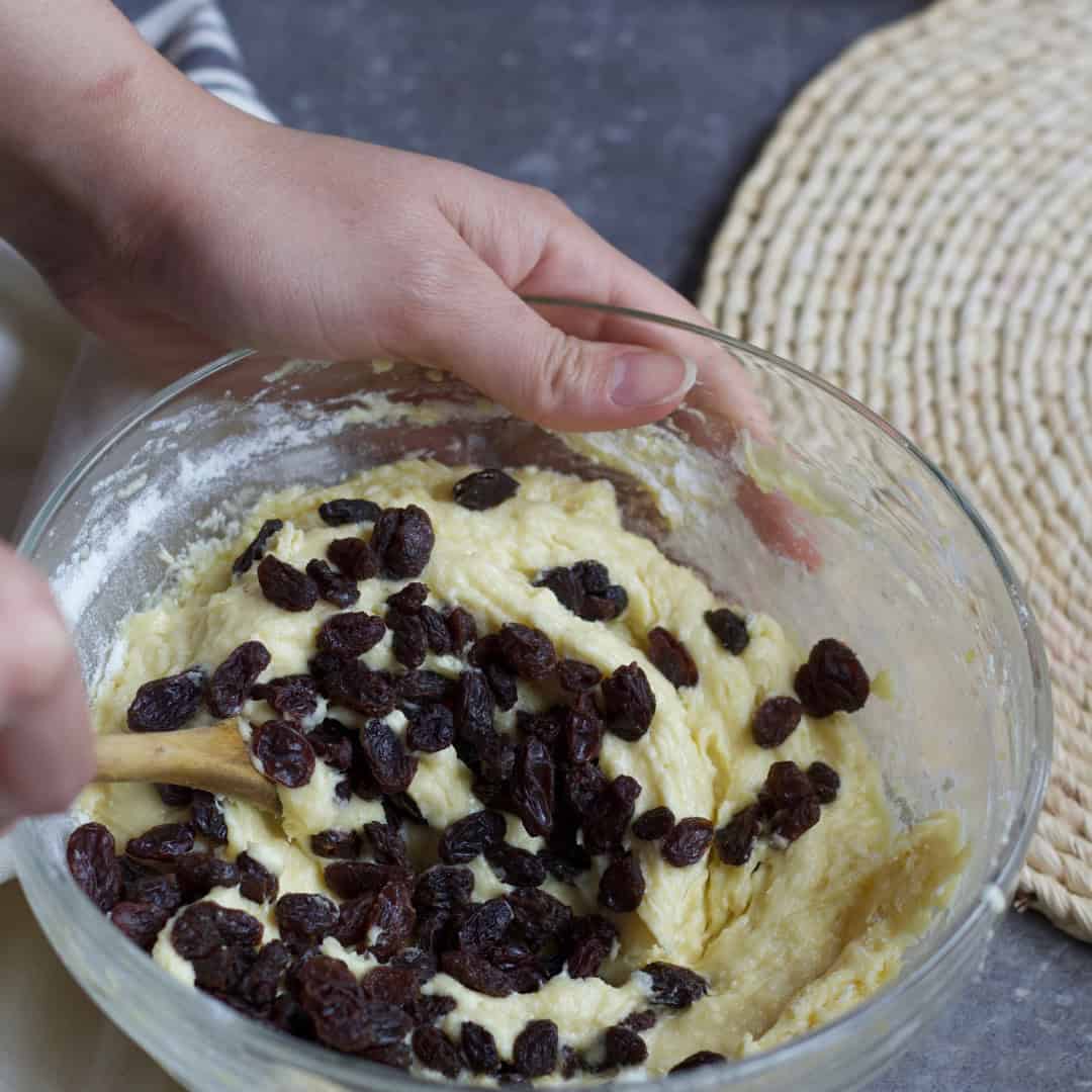 Fold the raisins into the cookie dough, make sure they're distributed evenly.