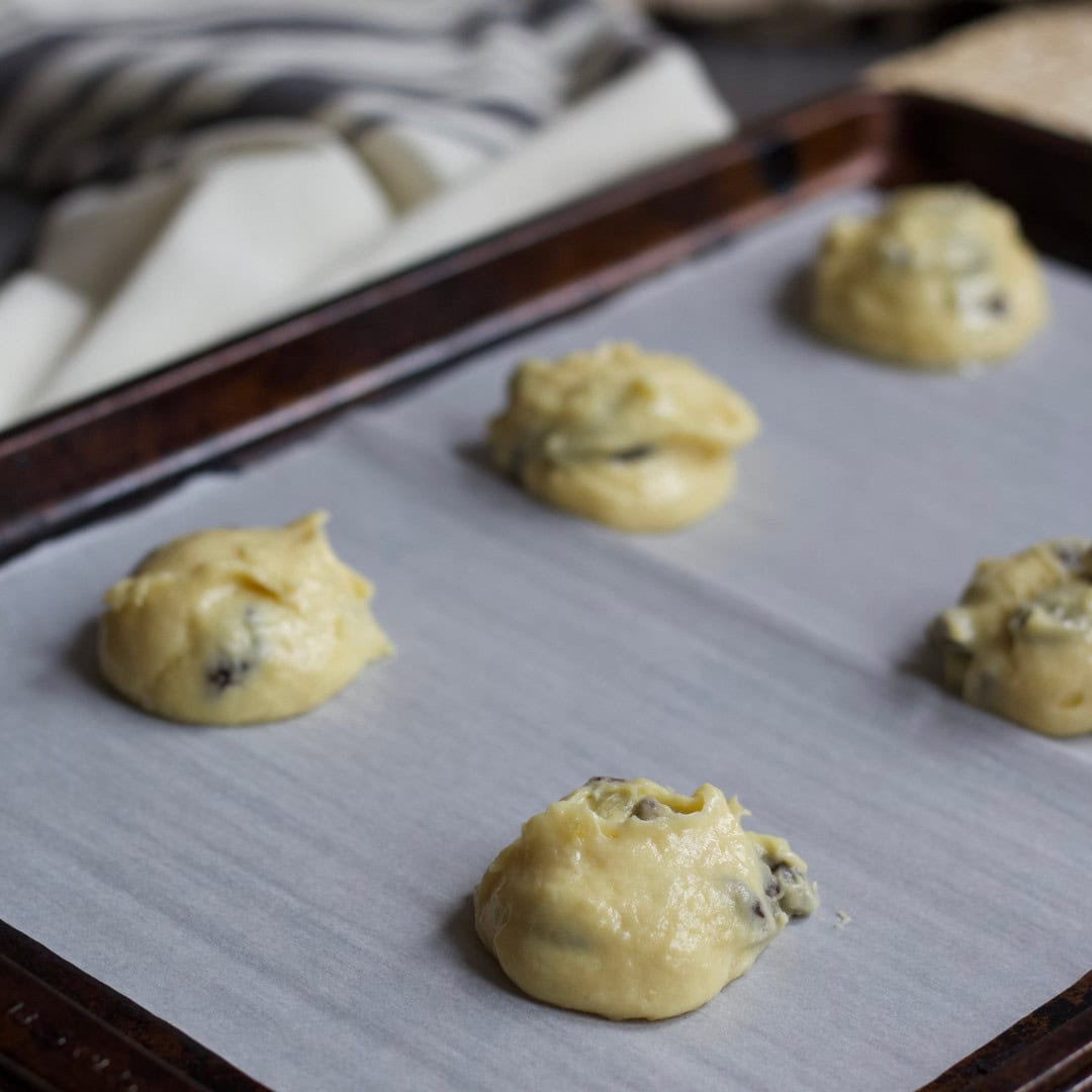 Drop scoops of cookie dough (one tablespoon) on a prepared baking sheet, leaving a 2-inch space between the cookies since they spread while baking.