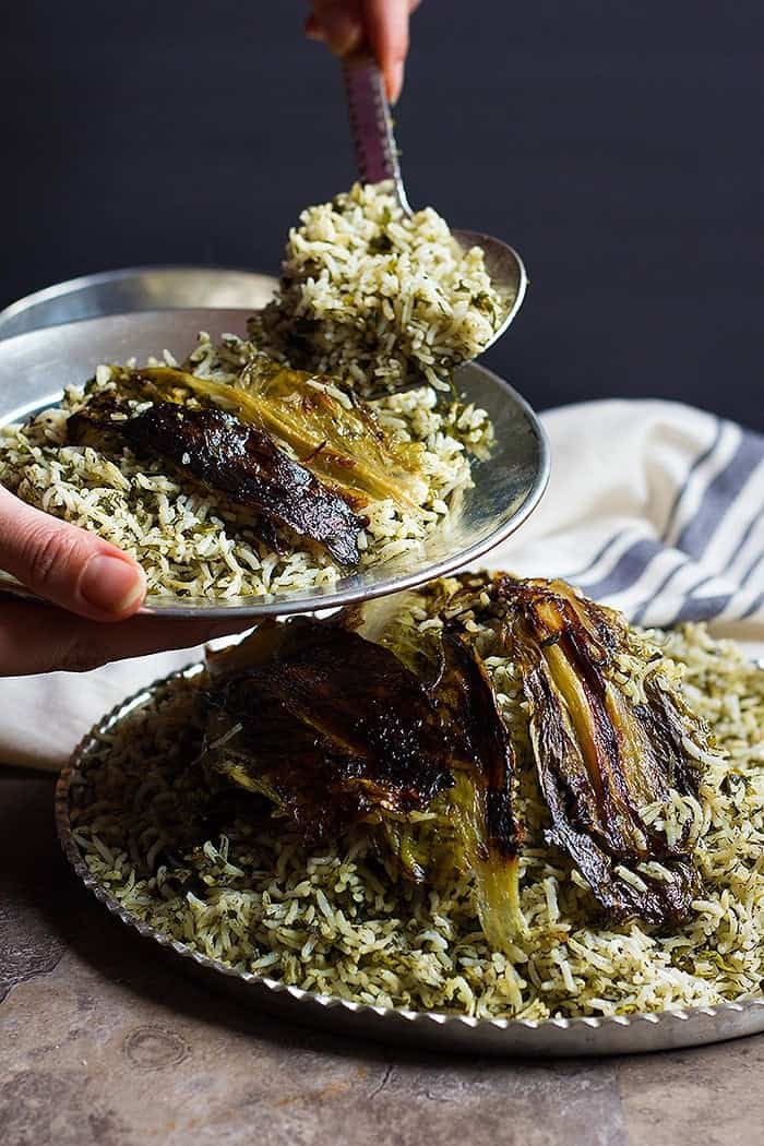 Sabzi Polo (Persian Herbed rice) made with fresh herbs and a delicious lettuce tahdig. 