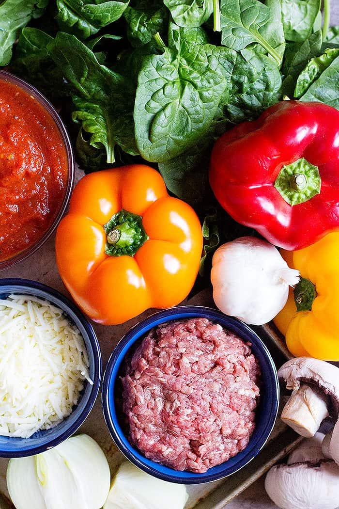 stuffed bell peppers with ground beef, spinach, mushrooms, pasta sauce, garlic and rice. 