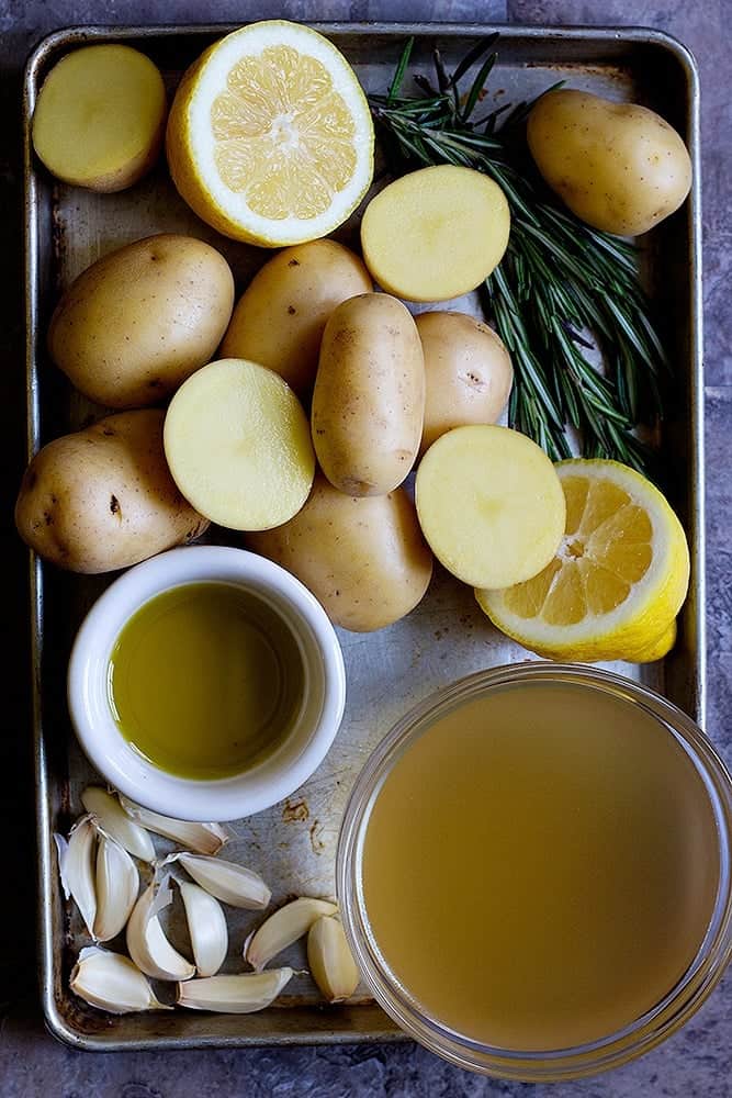 Greek potatoes recipe calls for potatoes, lemon, rosemary, olive oil, chicken broth and garlic