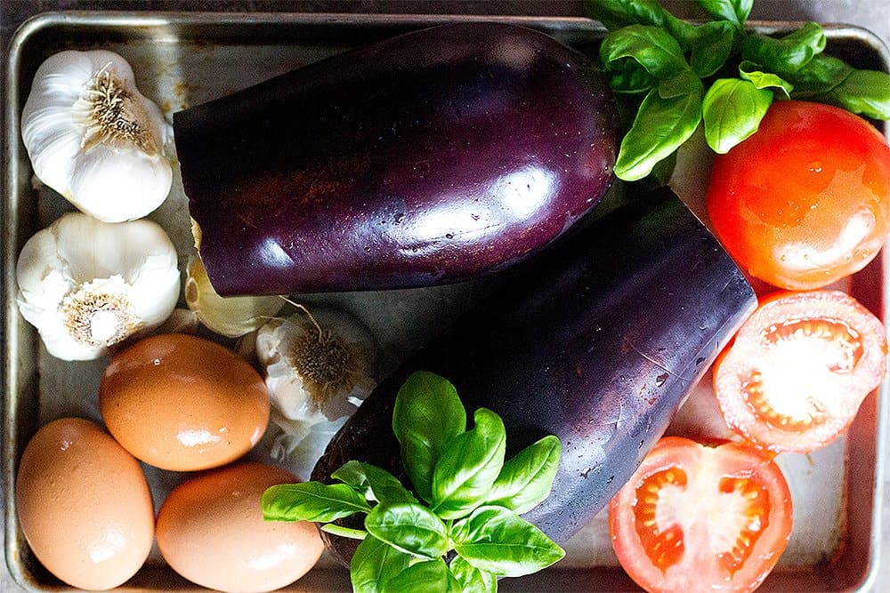 To make mirza ghasemi you need eggplants, garlic, tomatoes and eggs.