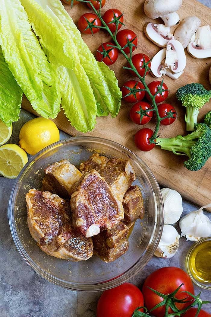 Marinate the lamb loin chops in an olive oil, herbs and garlic mixture.