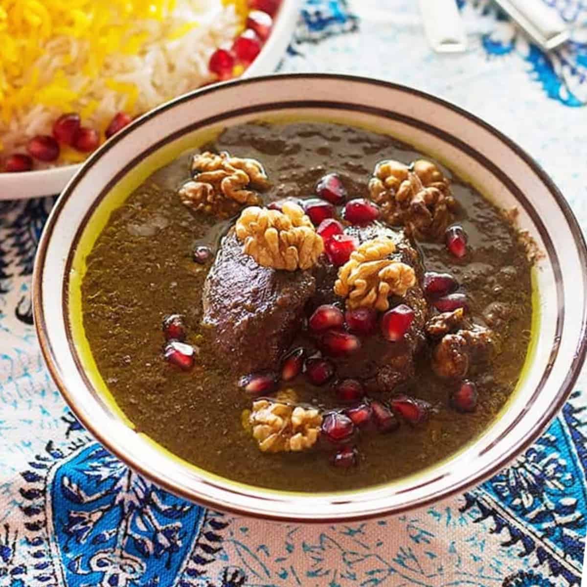 Fesenjan is a traditional Persian pomegranate and walnut chicken stew. It's sweet and sour with a rich nutty flavor, served over rice. The chicken is cooked in a rich walnut and pomegranate sauce until tender, making this a luscious and delicious meal.
