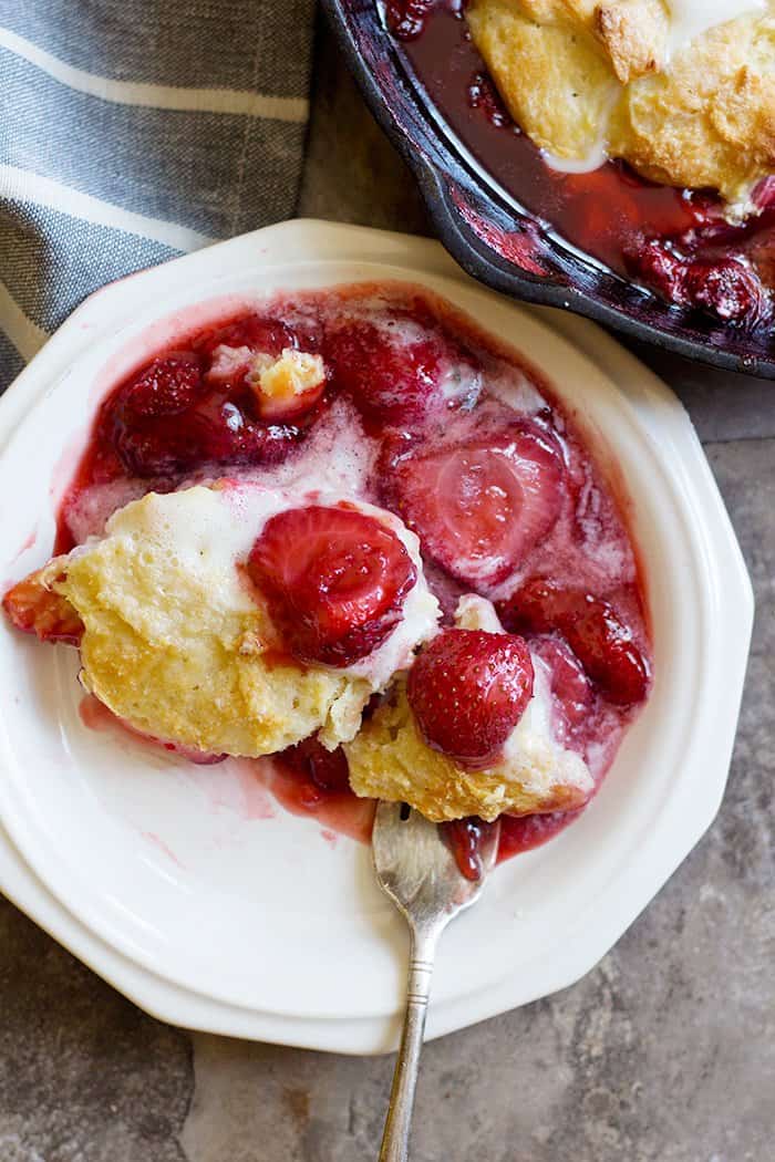 Put strawberry cobbler on a plate and top with vanilla ice cream. 