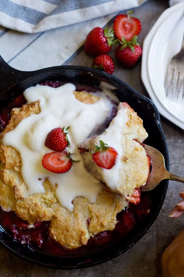 Strawberry cobbler is the ultimate summer dessert especially when served with ice cream. This cobbler recipe is easy to make and is perfect for dessert.