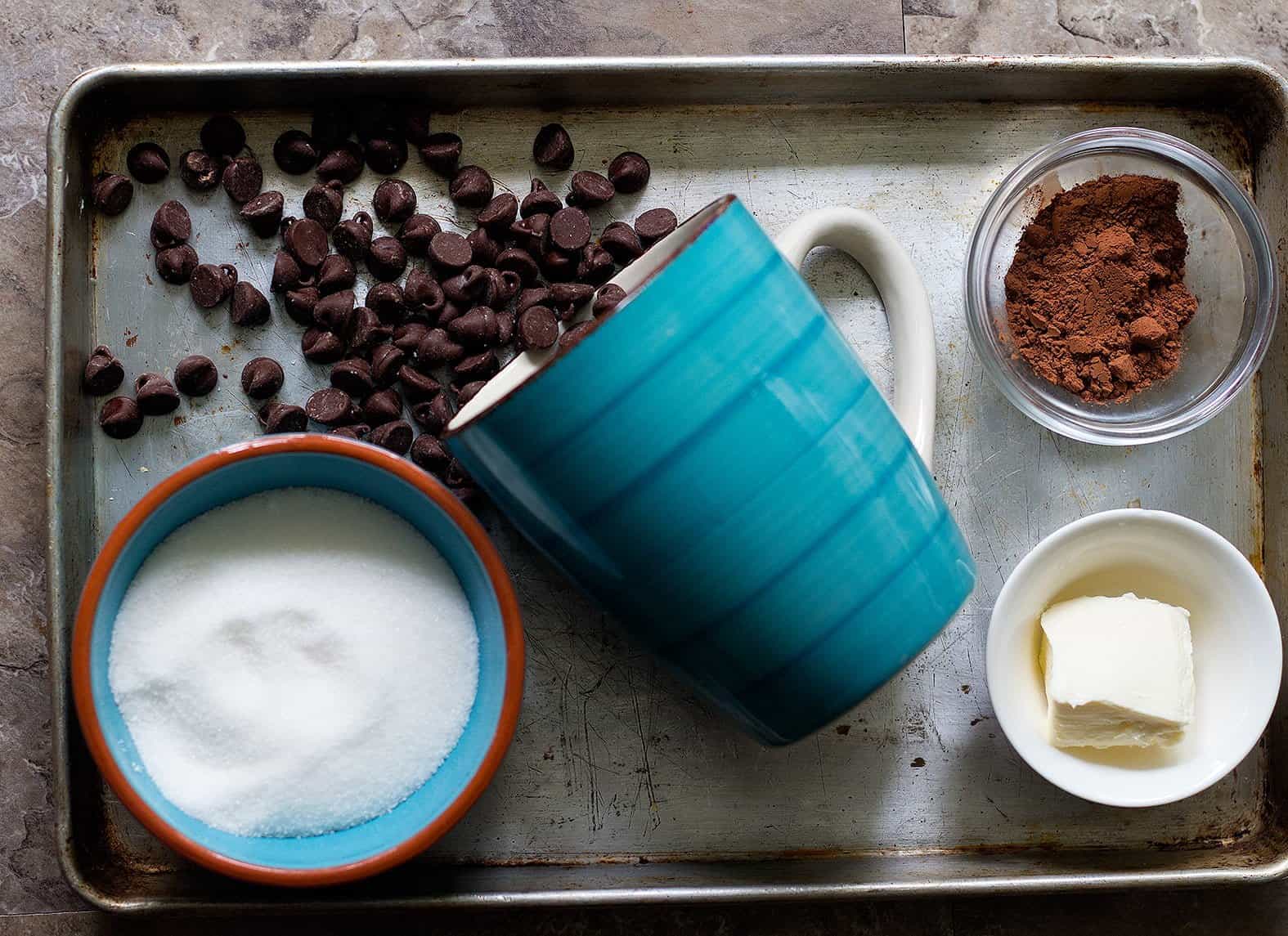 To make this recipe you need butter, sugar, cocoa powder, water and chocolate chips.