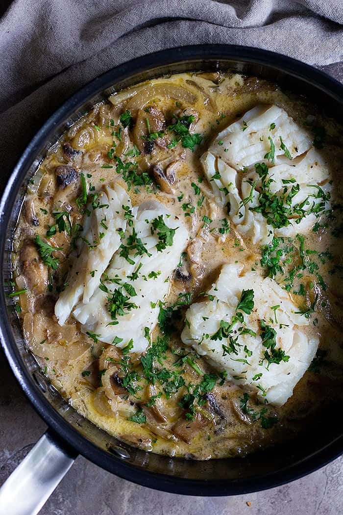 This pan seared cod is cooked in a flavorful shallot, fennel and mushroom sauce and served with some dill rice. It's a simple cod recipe makes the perfect dinner is less than one hour.