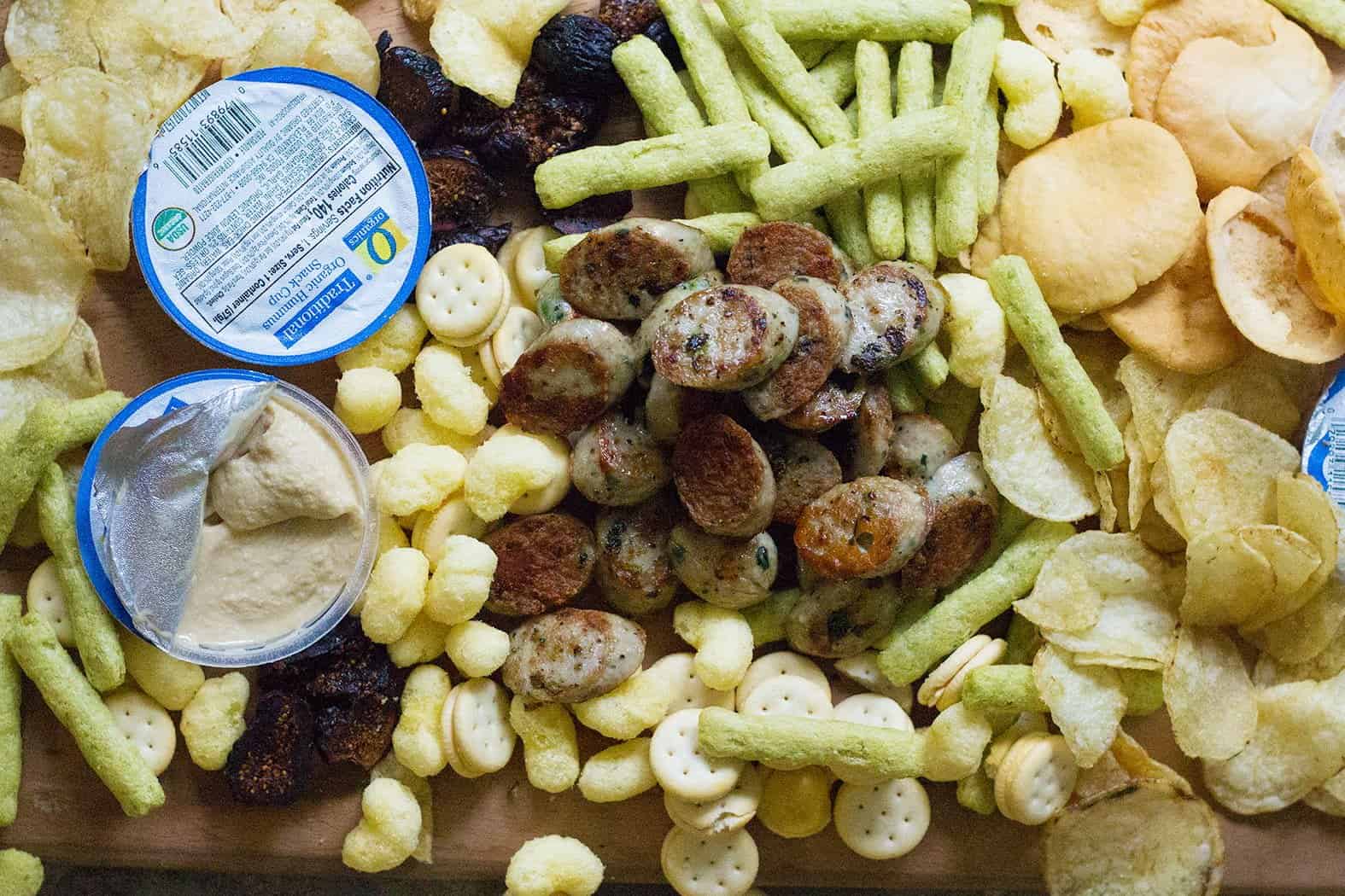 Snack board with hummus and pita chips. 