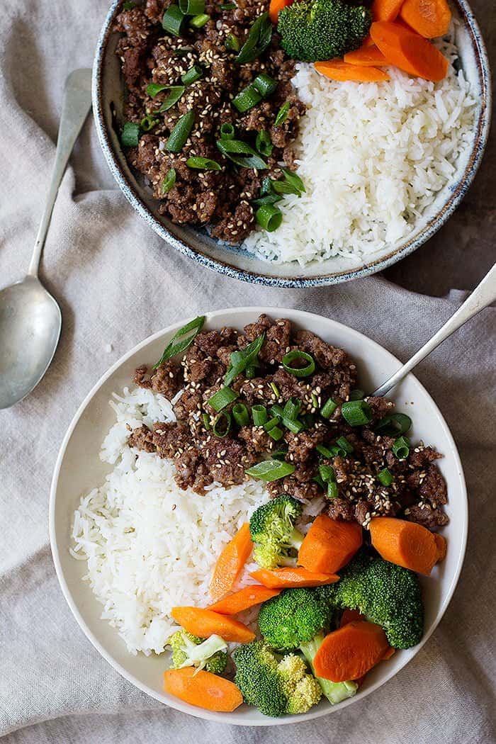 Korean beef bowl is the ultimate weeknight dinner. Flavorful ground beef and rice cooked in a flavorful sauce make an easy meal in only twenty minutes!