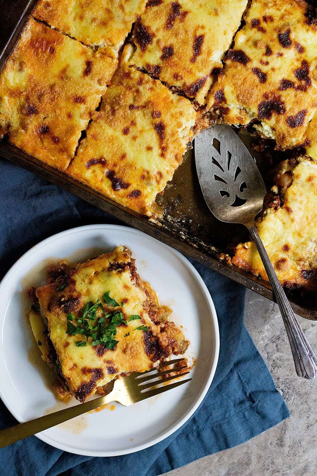 Greek moussaka is a classic Greek comfort food made with layers of eggplant, ground meat and bechamel sauce.