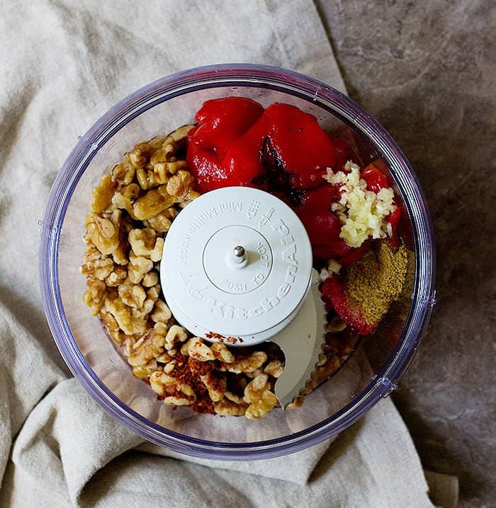 to make muhammara sauce, place all the ingredients in a food processor.