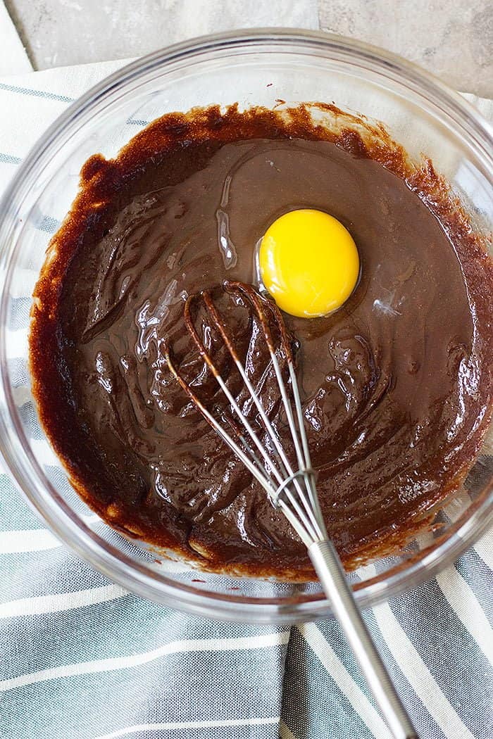 Add eggs one after another and mix well after each addition so homemade brownies have a good texture. 