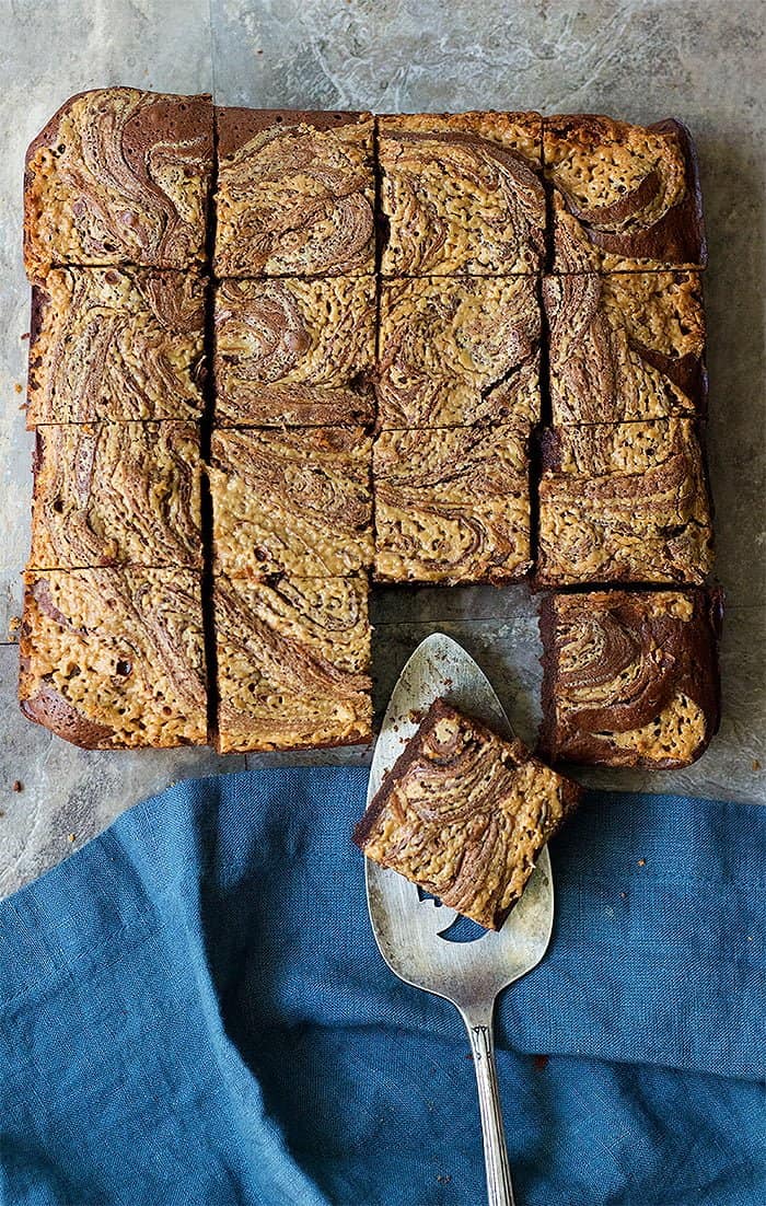 Fudgy chocolate brownies topped with a luscious peanut butter swirl are absolutely delicious. Learn how to make peanut butter brownies from scratch and wow everyone! 