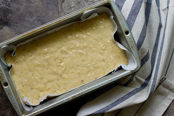 Pour the zucchini banana bread batter into a loaf pan