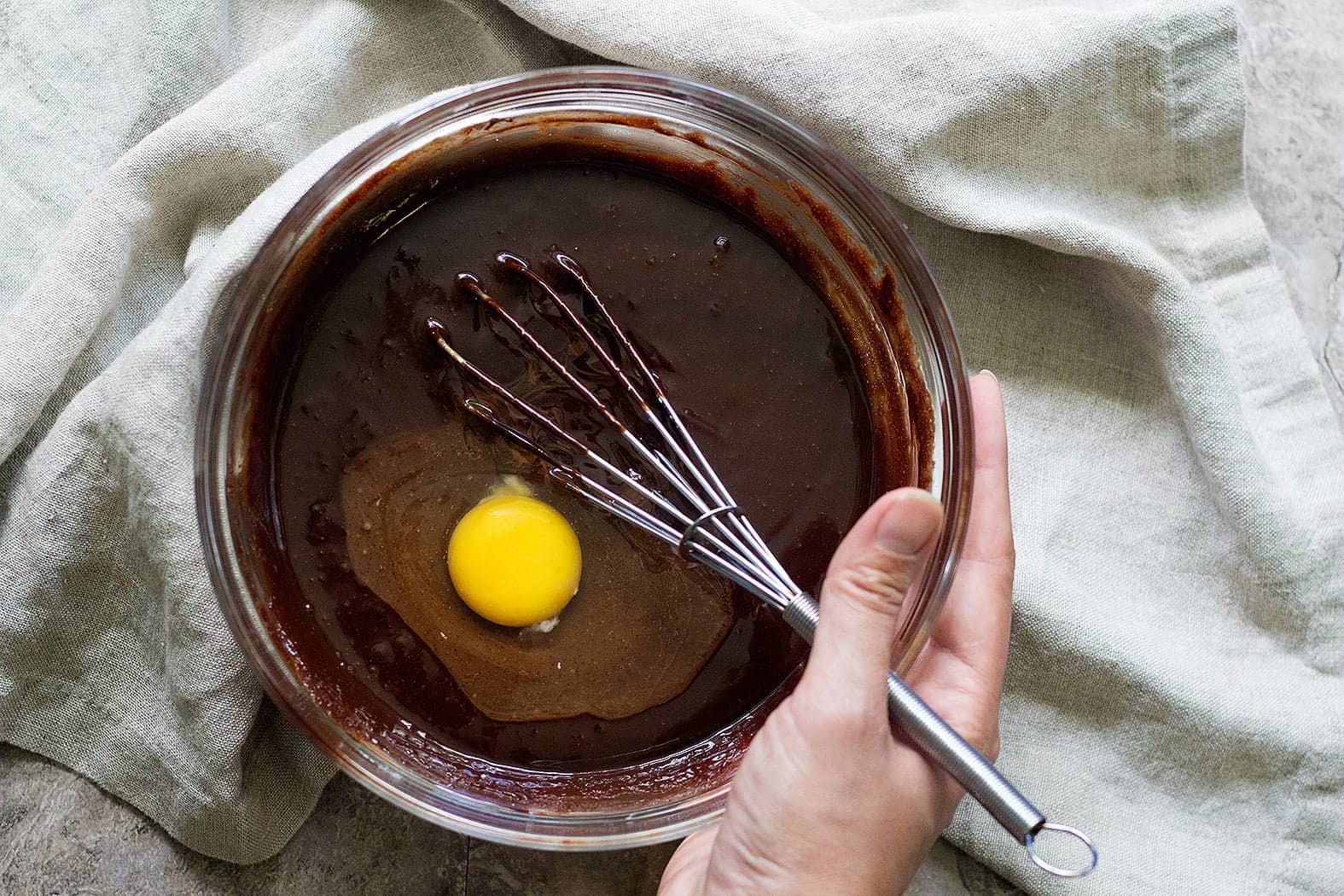 Add the eggs one by one to the oreo brownie batter. 