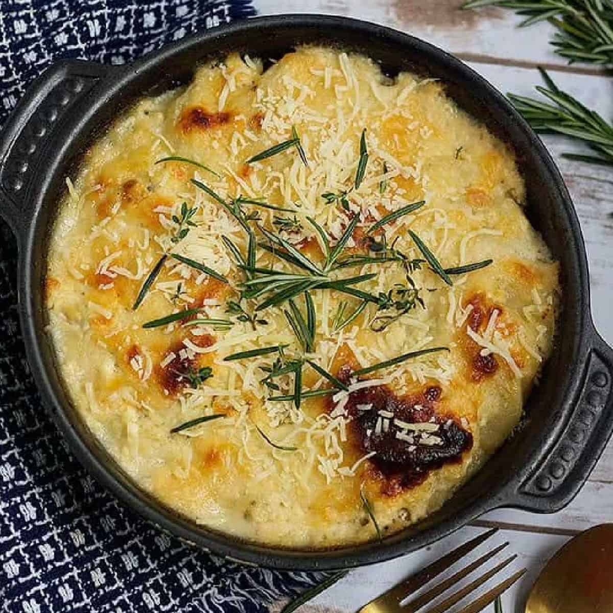 This cheesy scalloped potatoes recipe is a keeper. It's rich and creamy, with so much flavor and makes any meal so much better!