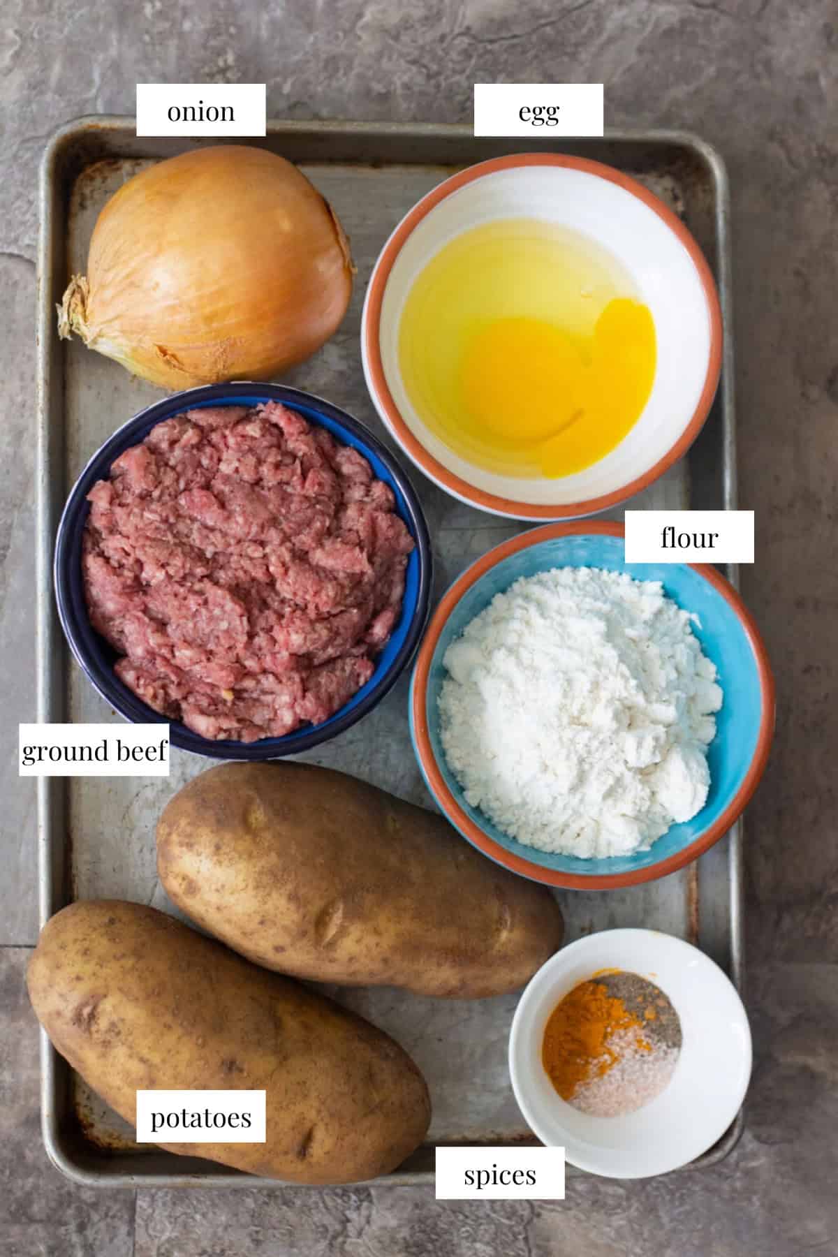 To make Kotlet, you need ground beef, potatoes, onion, egg, spices and flour. 