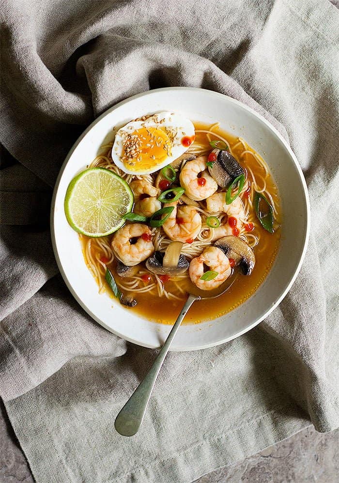 overhead shot of spicy ramen with shrimp and eggs. 