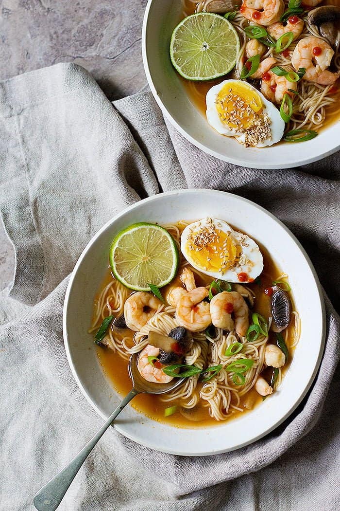 two bowls of spicy ramen with shrimp. 